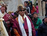 Mustang Lo Manthang Tiji Festival Day 3 07-3 Future King and Richard Bloom Join Crowd Outside Main Gate Richard Bloom, the head of the American Himalayan Foundation, and the Future King of Mustang made an appearance as the procession came outside the main gate of Lo Manthang on day three of the Tiji Festival. The man on the left holds a ritual musket, which is no longer used in the Tiji Festival.